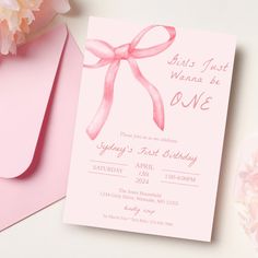 a pink card with a bow on it