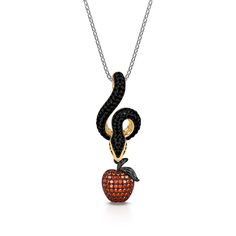 This piece is inspired by the story of Adam and Eve, who eat the forbidden fruit, due to the temptation of Satan disguised as a serpent. Crafted in sterling silver, this necklace features a snake carrying a red apple in its mouth. This piece is flooded with hand-set stones, to keep it shining from all angles. If you are interested in snake jewelry, just add this necklace to your jewelrybox.Carat Weight: 7.419 ctStone Size: 0.8,1.0,1.3,0.8,1,1 mmStone Type: Jeulia® StoneNumber of Stones: 201 Ston Snake Jewerly, Story Of Adam And Eve, Serpent Jewelry, Emerald Green Necklace, Artistic Earrings, Forbidden Fruit, Fruit Jewelry, Snake Jewelry, Snake Necklace