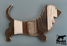 a wooden dog is hanging on the wall