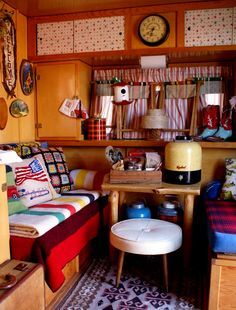 a living room filled with lots of furniture next to a wall mounted clock on the wall