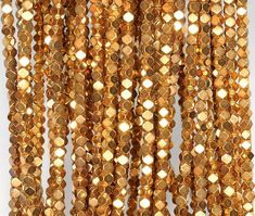 gold colored beads hanging from the ceiling