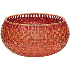 a red basket that is sitting on top of a white surface with an intricate design