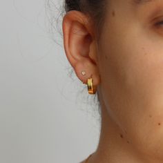 These dainty sterling silver Huggies / open style hoops feature a bezel set crystal, they are tiny and are absolutely gorgeous on. They look fabulous worn solo or with multiple piercings. Great for first, second or third hole piercings.  Open hoop / huggies are easy to put on - simply slide in and keep turning until the end is flush with the front of the lobe. Great huggies for everyday and perfect for multiple piercings 💖 Details 925 Sterling Silver & Gold Plating Diameter: 10 mm Width: 3 mm Online store: www.thejewellerytree.net 💕 Stay up-to-date with new designs & special offers  - FOLLOW ME   Socials: @myjewellerytree OR  https://www.facebook.com/thejewellerytree1/  💕 Need more info, feel free to email - I'd love to help 💕And please visit my store https://www.etsy.com/au/shop/TheJe Silver Huggies, Multiple Piercings, Earring Gold, Jewelry Tree, Gold Earring, Huggie Earrings, Fabric Bag, Jewelry Earrings Hoops, Gold Plated Silver