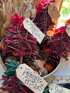 a basket filled with pine cones and other items that are for sale on the table