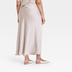 Dress up for brunches, lunches or dinners in chic style with this Maxi Slip Skirt from A New Day™. This maxi-length slip skirt is made from lightweight satin fabric for all-day comfort, while the full elastic waistband lends a secure fit. Tailored in a high-rise silhouette with a slim fit for a flattering look, you can pair this skirt with your fave tops and footwear for versatile ensembles. A New Day™: Style that goes wherever you do. Solid Satin Maxi Skirt For Summer, Elegant Rayon Maxi Skirt For Spring, Spring Satin Maxi Skirt Flowy, Chic Satin Maxi Skirt For Spring, Elegant Relaxed Maxi Skirt For Brunch, Elegant Relaxed Skirt For Brunch, Casual Satin Long Skirt, Spring Casual Silk Skirt, Casual Satin Skirt For Summer