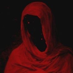 a person in a red cloak with black eyes