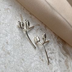 Flower Stud Earrings, 925 Silver Earrings, Cute Earrings, Unique Earrings, Nature Lover Jewelry, Women Jewelry, Gift for her Designed and made in the USA Love ♥ jewoloji | Made with 925 Silver , ~ 2.5 gr MAKING DAINTY JEWELRY WITH SILVER IS DIFFICULT, BECAUSE SILVER IS SO SOFT. WHEN YOU USE THESE EARRINGS PLEASE BE GENTLE. MAKE SURE YOU STORE THEM IN PLASTIC BAGS, IN A DARK PLACE WITH LOW HUMIDITY TO PREVENT TARNISH FOR A LONGER TIME. jewoloji DOES NOT USE NICKEL PLATE FOR SILVER COVERING FOR SENSITIVE SKINS. SO IT IS NATURALLY POSSIBLE TO OXIDIZE. THERE ARE LOT OF  MATERIALS TO REFRESH IT AGAIN. MAKE SURE IT IS SILVER FRIENDLY ! ♥ SHIPPING  | All jewelry is packaged in a jewelry box that is chic and elegant, suitable both for keeping and gifting. | Free and Fast Domestic Shipping in the U Silver Pierced Ear Climbers For Anniversary, Sterling Silver Flower Earring, White Gold Ear Climbers With Matching Earrings As Gift, White Gold Ear Climbers As A Gift, Sterling Silver Pierced Ear Climbers For Anniversary, Sterling Silver Pierced Ear Climbers As Gift, Sterling Silver Ear Climbers For Anniversary, Silver Ear Climbers As A Gift, Elegant Silver Ear Climbers As Gift