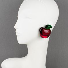 This is part of Chairish’s Costume Jewelry assortment.  Whimsical oversized Lucite clip-on earrings designed by Harriet Bauknight for Kaso in the 1980s. They feature a dimensional apple shape, all carved with ruby red and emerald green colors and mirror-textured effects.  The Kaso paper sticker was removed, but the gray background and the specific rotating clip back are unmistakable brand signatures.  Measurements: 2.19 in long (5.5 cm) x 1.88 in wide (4.8 cm) x 0.69 in deep (1.7 cm).  About: Ha Redesign Ideas, Apple Earrings, Lucite Jewelry, Apple Shape, Apple Shaped, Paper Sticker, Clip Earrings, Winter 2024, Green Apple