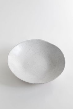 a white bowl sitting on top of a table