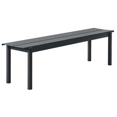 a black bench sitting on top of a white floor