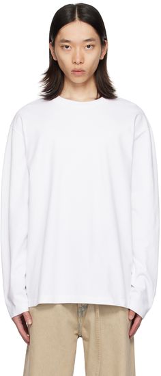 Heavyweight GOTS-certified organic cotton jersey T-shirt. · Rib knit crewneck · Dropped shoulders · Logo patch at back collar Part of the FRAME collection. Supplier color: Optic white White Sweatshirt With Ribbed Neckline For Streetwear, White T-shirt With Ribbed Neckline And Relaxed Fit, White T-shirt With Ribbed Neckline For Everyday, White Crew Neck Sweatshirt With Ribbed Neckline, White Sweatshirt With Ribbed Crew Neck, White Crew Sweatshirt With Ribbed Neckline, Oversized Crew Neck T-shirt With Ribbed Cuffs, White Oversized Crew Neck T-shirt, White T-shirt With Ribbed Cuffs In Relaxed Fit