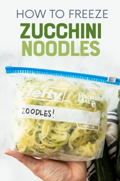 someone holding up a bag of zucchini noodles