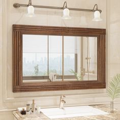 a bathroom sink under a mirror next to a window with the city in the background