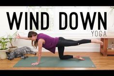 a woman doing a yoga pose with the words wind down above her and an image of a cat