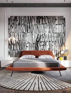 a modern bedroom with an abstract painting on the wall above the bed and rug in front of it