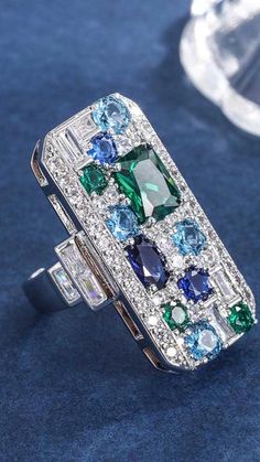 This exquisite vintage ring is designed with emerald and sapphire gemstone.  It is fashionable and generous.  It is a female exclusive jewelry, suitable gifts for mother, lover, friend and yourself. Silver Sapphire Ring With Rectangular Gemstone, Elegant Multi-stone Healing Jewelry, Elegant Birthstone Rings For Healing, Multi-stone Ring With Rectangular Stone As Gift, Multi-stone Ring With Rectangular Shape For Gift, Rectangular Multi-stone Ring For Gift, Rectangular Multi-stone Ring As Gift, Dazzling Multi-stone Sapphire Jewelry, Silver Emerald Ring With Gemstone For Promise