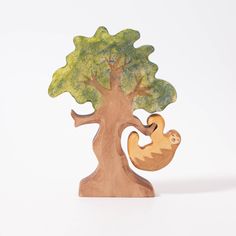 a wooden sculpture of a slotty in a tree