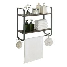 a shelf with towels, soaps and other bathroom items on it in front of a white background