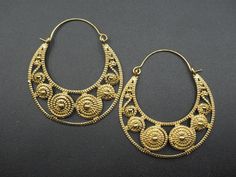 Premium gold plated brass earrings with unique and intriguing design patterns. RETURNS: Our major goal is to present all products as promised with accurate item descriptions along with pictures. But there are times when you may need to return occasionally. Returns are happily accepted but then we kindly request you to complete all your return within 30 days of receiving your item/s. **All the item/s must be returned unused and without any damage in the same condition you received it, with proper Intricate Brass Drop Earrings Danglers, Festive Gold Brass Plug Earrings, Filigree Chandbali Earrings, Metal Chandbali Earrings With Filigree, Intricate Brass Drop Danglers, Brass Danglers With Intricate Design, Festive Brass Pierced Plug Earrings, Yellow Gold Brass Earrings For Festivals, Festive Gold Metal Hoop Earrings