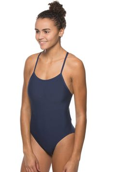 The Perry is a non-adjustable swim onesie that features contrasting stitching and binding for a crisp, athletic look. The contemporary design includes two over-the-shoulder straps that criss-cross along the back and transition into a cut-out detail along the ribcage. Features medium bum coverage, tagless care instructions, and privacy lining to keep even the lighter-colored suits from revealing too much.Super durable with reinforced stitchingOutside Fabric: 100% PolyesterInside Lining: 100% Poly Summer Sports Bodysuit With Cross Back, Summer Sports Cross-back Bodysuit, Sporty Bodysuit With Solid Back For Summer, Sporty Seamless Racerback Swimwear, Athleisure Cross Back Swimwear For Summer, Athleisure Cross-back Swimwear For Summer, Summer Sports Bodysuit With T-back, Summer Sports T-back Bodysuit, Summer T-back Sports Bodysuit