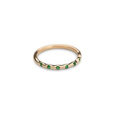 Fall in love with our 14k Solid Gold and Emerald Stackable Ring. Classy and timeless. The perfect gift for a special someone or simply as a reminder to love yourself! Featuring 7 Genuine ethically sourced Emeralds Material: 14k Gold and Genuine Emeralds Please note, our current processing time for this ring is 1 - 2 weeks. Elegant Eternity Band For May Birthstone, Oval 14k Gold Eternity Band, Elegant Round Emerald Ring With Half Eternity Band, Elegant Round Emerald Ring With Half Eternity Setting, Elegant Emerald Half Eternity Ring, Fine Jewelry Stackable Emerald Ring With Round Band, Elegant Stackable Rings With Round Band For May Birthstone, Elegant Stackable Emerald Promise Ring, Elegant Stackable Half Eternity Rings With May Birthstone