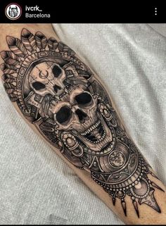 a man with a skull tattoo on his arm