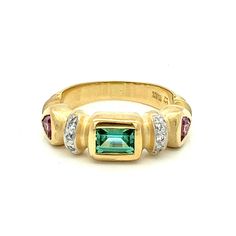 Green and Pink Tourmaline with Diamonds Ring-  18k Yellow Gold Matte Finish ~  October  Birthstone Ring - Size 6.75- ET1247 Radiating beauty and grace, this Green and Pink Tourmaline ring is a true gem. The tourmaline stones are very high quality, and have beautiful colors. This colors are  brought out by the matte finish of the ring, and the sparkle from the accent diamonds. Ring Size: 6.75: can be sized Metal Content: Solid 14k Yellow Gold Gemstones: 1.14 ctw 2 Pink Tourmaline 4.5mm trillion cut 1 Green Tourmaline 6.5 x 4.5 emerald step cut Diamonds Number of diamonds: 6 Round Brilliant cut Natural Diamonds  Carat 0.06ct Clarity: SI1 Color: G Measurements: Face of ring (North/South): 7mm Height of ring off of finger: 4mm Ring Shank width:  3mm Weight: 8.44 Grams Stamps: 18k Condition: Ne Tourmaline Birthstone Ring For Formal Occasions, Yellow Gold Emerald Ring With Gemstone Accents, Formal Fine Jewelry Tourmaline Birthstone Ring, Tourmaline Gemstones With Accent Stones For Anniversary, Tourmaline Rings With Gemstone Accents For Anniversary, Heirloom Emerald Ring With Gemstone Accents For Formal Events, Anniversary Rings With Tourmaline Gemstone Accents, Fine Jewelry Yellow Gold Emerald Ring With Gemstone Accents, Gold Tourmaline Rings With Gemstone Accents