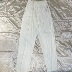 White Size Small Measurements Flat: Waist 11”, Hip 16”, Rise 13”, Inseam 29” Vintage, High Waisted, Office Siren Trousers, Pleated, Summer White Tapered Leg Bottoms For Spring, Spring White Tapered Leg Bottoms, White Bottoms With Belt Loops For Work, White Workwear Bottoms With Belt Loops, White Stretch Bottoms With Tapered Leg, White Stretch Tapered Leg Bottoms, White High Waist Pants With Elastic Waistband, Fitted White Tapered Leg Pants, High Waist White Pants With Belt Loops