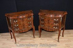 two wooden dressers sitting on top of a hard wood floor next to each other