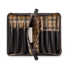 Take pens or small tools with you in this zip-secure case with built-in pouch, crafted in our pebbled, full-grain mocha leather with plaid twill lining. The attached zippered accessories pouch can hold ink refills, erasers or other small items. It holds up to seven instruments of varying sizes, each in their own sleeve. Leather Business Organizer With Pen Slots, Classic Cases With Pen Slots, Leather Organizer With Pen Slots For Business, Classic Cases With Pen Slots For Everyday Use, Brown Organizer With Pen Slots For Daily Use, Personalized Stocking Stuffers, Leather Pen Holder, Leather Pen Case, Work Supplies