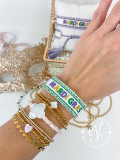 Mardi Gras Embroidered Bracelet / Tassel Mardi Gras Bracelet / Fat Tuesday / Mardi Gras / Friendship Statement Bracelet Great to add to your Bracelet Stack for Mardi Gras Mardi Gras Bracelets come as pictured  Choose from: #15 White/Purple or #53 White/Emerald Green **LISTING IS FOR (1) BRACELET** **Colors/shades of bracelets may vary depending on availability** Designed and Curate by EstelleJoyLynn, LLC Adjustable Embroidered Multicolor Beaded Bracelets, Gold Letter Beads Bracelets For Festival, Adjustable Multicolor Embroidered Beaded Bracelet, Adjustable Embroidered Bangle Bracelet, Gold Festival Bracelets With Letter Beads, Gold Bracelets With Letter Beads For Festivals, Gold Embroidered Bangle Bracelet, White Embroidered Bracelet As Gift, Handmade Adjustable Jewelry For Mardi Gras