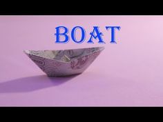 an origami boat with the word boat on it