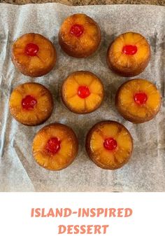 nine pineapple upside down cakes sitting on top of a piece of wax paper