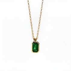 14k Yellow Gold Radiant shape Emerald (may birthstone) Gold Bezel Setting Pendant Necklaces. Main Stone: Radiant Shape Natural Emerald In Weight Of 0.45 Ct Color - Green Chain length 45cm (17.7inch) with a stop at 42cm (16.5inch) for shorter option Alena Diamonds & Jewelry was created from our passion for custom-made jewelry, and for fulfilling our customer's fantasies. We are Alex and Maayan, we created Alena after years of experience we received by working in the jewelry industry, Starting from diamond gemology in the Israeli diamond exchange, and then making fine crafted gold jewelry with our beautiful diamonds that we choose one by one very carefully and by our long experience of diamond gemology. Alex is a certified Diamond gemologist by C.G.S gemology known school in the diamond exch Green 14k Gold Jewelry With Bezel Setting, Yellow Gold Necklace With Emerald Cut Bezel Setting, Yellow Gold Emerald-cut Necklace With Bezel Setting, Yellow Gold Emerald Cut Necklace With Bezel Setting, 14k Gold Emerald Cut Birthstone Necklaces, Classic Green Emerald Necklace With Bezel Setting, Emerald Cut Birthstone Necklace In 14k Gold, 14k Gold Emerald Cut Birthstone Necklace, May Birthstone Necklace In 14k Gold With Bezel Setting