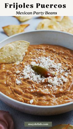 a white bowl filled with salsa and tortilla chips