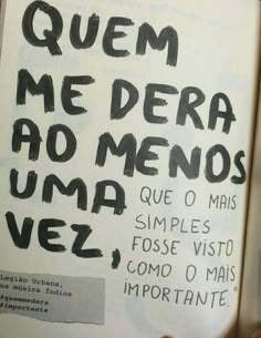 an open book with writing on it in black and white ink that reads quem me dera ao menos uma vez