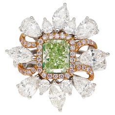 GIA Certified 1.39 carat radiant cut fancy intense yellowish green diamond ring. Adorned with 4 marquise and 8 pear cut diamonds, weighing 2.8 cttw. Bezel set center stone with 26 round diamonds (0.44cttw) and 38 round cut pink diamonds (0.19 cttw) forming a halo. The ring is crafted in 18k white and rose gold, weighing a total of 7.59 grams. This Fancy Intense Yellowish Green Diamond, one of the rarest shades in the world of Fancy Color Diamonds. Encircling this vibrant gem is a delicate floral Green Diamond Ring, Green Diamond Rings, Yellowish Green, Pink Diamonds, Fancy Lights, Yellow Diamond Rings, Colored Engagement Rings, Pear Cut Diamond, Contemporary Ring