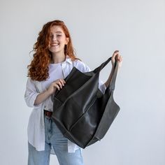 This handmade women hobo bag is produced of Italian pebbled very soft leather. It has one large compartment and has one pocket - inside. This bag is simple, reliable, and durable. Its universal look allows to use the bag for various purposes. One may take the bag to the work, shopping, meeting, or walk and feel comfortable with it at any conditions. SIze and Dimensions: Large: Height: 16.14 inches (41 cm) Width: 12.2 inches (31 cm) Depth: 10.2 inches (26 cm) Inside pocket: Height: 12.2 inches (3 Leather Hobo Bag Tote With Soft Leather, Modern Hobo Bucket Bag For Everyday, Modern Everyday Hobo Bucket Bag, Everyday Black Hobo Bag With Rolled Handles, Everyday Tote Hobo Bag With Leather Handles, Versatile Leather Hobo Bucket Bag, Everyday Leather Handle Hobo Tote Bag, Textured Leather Hobo Bag For Everyday Use, Leather Handle Tote Hobo Bag For Everyday