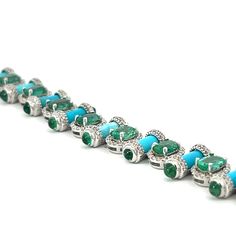 Discover the captivating beauty of our Emerald, Turquoise and Diamond Bracelet. The striking combination of vivid oval and cabochon emeralds makes this piece truly unique. Elevate any outfit with its alluring colors and exquisite design. Expertly crafted for those who appreciate rare and stunning jewelry. Jewelry Style : BraceletMetal Type : 18K White GoldTotal Weight : 23 gramsMeasurement : 7 inchesEmerald : Oval : 11.05 ctw. Diamonds : Round : 2.61 ctw. Turquoise : 11.32 ctw. Luxury Turquoise Oval Bracelets, 18k Gold Bracelet, Emerald Bracelet, Jewelry Style, Classic Jewelry, Stunning Jewellery, Rocks And Minerals, Exquisite Design, Estate Jewelry