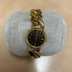 Timex Ladies Watch Ba Cell Gold Toned Heavy Chain Bracelet. An Unusual Timex Ladies Watch Gold Toned With Heavy Chain Bracelet Round Case Housing Black Face Gold Slanted Hour Marks And Gold Hands. Needs Battery. New Old Stock Item Great Condition, Comes As Pictured All Items Are Sold In As Is Condition And Are Subject To Final Sale Gold Metal Watch With Chain Detail, Gold Metal Watches With Chain Detail, Timeless Metal Watch With Chain Detail, Timeless Metal Watch With Chain, Timeless Metal Chain Watch, Timeless Metal Chain Watches, Classic Gold Chain Watch, Formal Gold Chain Watch, Gold Metal Evening Watches