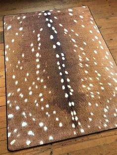 a brown rug with white spots on it