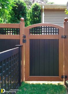 a wooden gate in front of a house