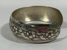 "Etched floral pattern cuff bracelet by Beau Sterling. Fits snug on average wrist, it is 2 1/8\" x 1 3/4\" and in very nice used vintage condition. \"Vintage condition\" means that the item is not brand-new, may have been used, and as such may show signs of age/wear/use. Please check the photos and read my return policy carefully and convo me before you order if you have any questions. Jewelry sold in this shop are estate sale items and have been cleaned of surface or visible dirt, but may not h Vintage Etched Cuff Bangle, Silver Bohemian Cuff Bracelet For Spring, Vintage Wide Band Bangle As Gift, Vintage Adjustable Cuff Bracelet For Spring, Adjustable Vintage Cuff Bracelet For Spring, Handmade Vintage Bracelets For Spring, Vintage Bracelet Jewelry For Spring, Vintage Spring Bracelet Jewelry, Vintage Spring Jewelry Bracelet