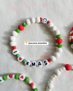 two christmas bracelets with candy beads and letters that spell out the word xmas