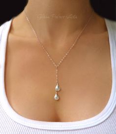 Graceful and dainty, perfect for everyday or to dress up any outfit! Teardrops are sterling silver and measure about 16mm Chain is a dainty and shiny sterling silver chain The length of the chain that goes around the neck not including dangle section is shown at a 17". You can choose a longer length during checkout - Please measure and choose the right length for you The teardrop cascade is an added 2 1/2 inches Necklace closes with a sterling silver spring clasp PACKAGINGAll Jewelry is carefull Womens Necklaces Simple, Silver Y Necklace, Fine Silver Jewelry, Y Necklace, Teardrop Necklace, Silver Jewelry Rings, Lariat Necklace, Silver Chain Necklace, Simple Necklace