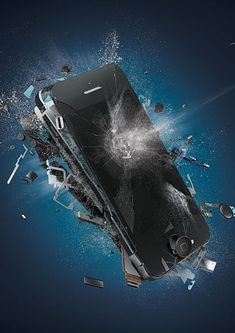 an image of a broken cell phone in the air with debris around it on a dark blue background