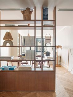 a room filled with furniture and books on top of shelves