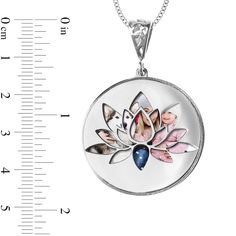 Show what your loved ones mean to you with the personalized and engravable details of this photo lotus flower swivel disc pendant. Fashioned in sterling silver The round disc features a photo of your choice - expertly transferred using modern technology - beneath a swivel disc with a lotus flower cutout design. All photo pieces are scratch resistant, 100% waterproof, and are available in high resolution color or black and white. Further customize the look with up to four lines of messages - each 20 characters max - inscribed along the backside. This pendant suspends along an 18.0-inch rope chain that secures with a spring-ring clasp. Please follow these steps: 1) Place your order; 2) Text your photo from your smartphone to (972) 483-2900; and 3) When prompted, please respond with your Orde Flower Cutout, All Photo, Photo Pendant, Cutout Design, Disc Pendant, 1 Image, 1 Place, Modern Technology, Rope Chain