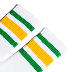 White athletic socks with green and gold stripes for men, women and children. White Cotton Retro Socks, Retro White Cotton Socks, Sporty Green Socks For Streetwear, White Casual Socks With Three Stripes, Casual White Socks With Three Stripes, Trendy White Streetwear Socks, Trendy White Socks For Streetwear, Sporty Yellow Cotton Socks, Sporty White Socks For Streetwear