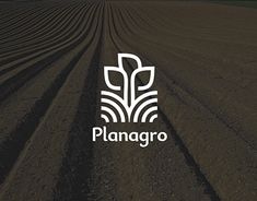 an image of a farm field with the word plangro written in white on it